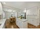 Bright kitchen features white cabinets, an island with marble countertop, and stainless steel appliances at 901 Scaleybark Rd, Charlotte, NC 28209