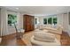 Bright living room with hardwood floors, large windows, and elegant decor at 901 Scaleybark Rd, Charlotte, NC 28209