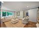Cozy living room featuring hardwood floors, neutral furniture, and ample natural light at 901 Scaleybark Rd, Charlotte, NC 28209