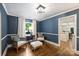 Sitting room featuring stylish decor, hardwood floors, and natural light at 901 Scaleybark Rd, Charlotte, NC 28209