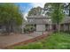 Charming backyard with wooden deck, garden beds, and a variety of trees at 9625 Surface Hill Rd, Mint Hill, NC 28227
