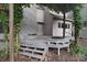 Backyard showcasing wooden deck, mature trees, and tranquil outdoor space at 9625-A Surface Hill Rd, Mint Hill, NC 28227