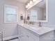 Well-lit bathroom with double vanity, marble countertop, and contemporary finishes at 9625 Surface Hill Rd, Mint Hill, NC 28227