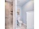 Updated bathroom featuring a tiled shower, neutral colors, and modern fixtures at 9625-A Surface Hill Rd, Mint Hill, NC 28227