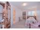Cozy bedroom features shelving and an attached bathroom for added convenience at 9625 Surface Hill Rd, Mint Hill, NC 28227