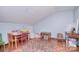 Spacious bonus room with hardwood floors, colorful rug, and decor at 9625-A Surface Hill Rd, Mint Hill, NC 28227