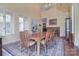 Dining room featuring natural light, a dining table with seating for eight, and decorative display cases at 9625-A Surface Hill Rd, Mint Hill, NC 28227