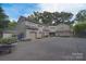 Exterior view of the property showcasing the multi-car garage and mature landscaping at 9625-A Surface Hill Rd, Mint Hill, NC 28227