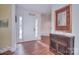 Bright and inviting foyer with tile flooring, a decorative mirror, and ample natural light, creating a warm welcome at 9625 Surface Hill Rd, Mint Hill, NC 28227