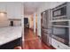 Gourmet kitchen features stainless appliances, granite countertops, and seamless access to the dining area at 9625 Surface Hill Rd, Mint Hill, NC 28227