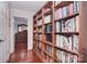 Hallway lined with floor-to-ceiling bookshelves at 9625-A Surface Hill Rd, Mint Hill, NC 28227