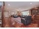 The expansive living room features hardwood floors, area rug, and comfortable seating furniture at 9625 Surface Hill Rd, Mint Hill, NC 28227