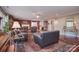 Spacious living room features hardwood floors, area rug, fireplace and easy access to kitchen and dining areas at 9625 Surface Hill Rd, Mint Hill, NC 28227