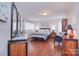 Spacious main bedroom featuring hardwood floors, soft lighting, and neutral decor at 9625-A Surface Hill Rd, Mint Hill, NC 28227