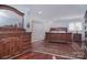 Elegant main bedroom with hardwood floors, dresser, decorative rug, and a sleigh bed at 9625 Surface Hill Rd, Mint Hill, NC 28227