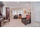 Home office space featuring neutral carpet and a window with plantation shutters at 9625-A Surface Hill Rd, Mint Hill, NC 28227
