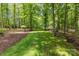 Expansive backyard featuring a well-maintained lawn and surrounding trees at 9831 Sedgefield Dr, Waxhaw, NC 28173