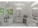 Bright bathroom with a soaking tub, granite countertops, and vanity with dual sinks at 9831 Sedgefield Dr, Waxhaw, NC 28173