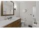 Stylish bathroom featuring a wood vanity with marble countertops at 9831 Sedgefield Dr, Waxhaw, NC 28173