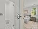Bathroom and bedroom with glass shower featuring stylish fixtures at 9831 Sedgefield Dr, Waxhaw, NC 28173
