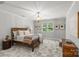 Bedroom with modern decor, a comfortable bed, and ample natural light from the windows at 9831 Sedgefield Dr, Waxhaw, NC 28173