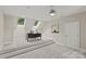 Bright bonus room with neutral colors and carpeting, skylights, and a large desk at 9831 Sedgefield Dr, Waxhaw, NC 28173