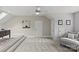 Bright bonus room with neutral colors and carpeting featuring a ceiling fan and recessed lighting at 9831 Sedgefield Dr, Waxhaw, NC 28173