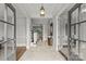 Inviting foyer with marble floors, a stylish pendant light, and an open view to the living spaces at 9831 Sedgefield Dr, Waxhaw, NC 28173