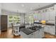 Spacious kitchen with granite countertops, white cabinets, an island cooktop and a breakfast nook at 9831 Sedgefield Dr, Waxhaw, NC 28173