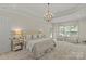 Relaxing main bedroom featuring a sitting area, neutral color palette, and lots of natural light at 9831 Sedgefield Dr, Waxhaw, NC 28173