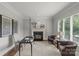 Elegant office space with a fireplace, built-in features, and ample natural light creating an ideal work environment at 9831 Sedgefield Dr, Waxhaw, NC 28173