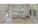 Cozy sitting area with natural light and views of the backyard and pool at 9831 Sedgefield Dr, Waxhaw, NC 28173