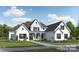 Stunning two-story white home featuring black shutters, complemented by professional landscaping and a well-manicured lawn at 04 Lurecliff Pl, Fort Mill, SC 29708
