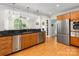 Open concept kitchen with stainless steel appliances and granite countertop at 1031 Eldorado Ave, Charlotte, NC 28262