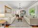 Spacious living room with hardwood floors, comfortable seating, and a bookshelf at 1031 Eldorado Ave, Charlotte, NC 28262