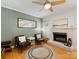 Cozy living room featuring a decorative fireplace, neutral tones, and inviting seating at 1031 Eldorado Ave, Charlotte, NC 28262