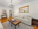 Bright living room with hardwood floors, neutral decor, and a stylish coffee table at 1031 Eldorado Ave, Charlotte, NC 28262