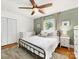 Comfortable bedroom with a ceiling fan, hardwood floors and great natural light at 1031 Eldorado Ave, Charlotte, NC 28262