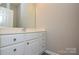 Powder room featuring a modern vanity and laminate flooring at 105 Woodsong Ln, Mooresville, NC 28117
