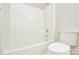 Bathroom features white fixtures, including toilet and bathtub with shower at 105 Woodsong Ln, Mooresville, NC 28117