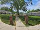 Neighborhood view of townhomes set around a grassy common area with picnic tables, offering community recreation spaces at 105 Woodsong Ln, Mooresville, NC 28117