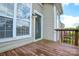A cozy wooden deck with outdoor lighting, offering a private outdoor living area and neighborhood views at 105 Woodsong Ln, Mooresville, NC 28117