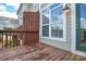 A private wooden deck with space for outdoor seating, offering a cozy outdoor living area with natural light at 105 Woodsong Ln, Mooresville, NC 28117