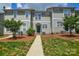 Inviting exterior of townhome featuring manicured lawn and walkway to front door at 105 Woodsong Ln, Mooresville, NC 28117
