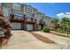 View of townhouses featuring garages and upper level decks, showcasing community living at 105 Woodsong Ln, Mooresville, NC 28117