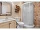 Bathroom featuring a vanity, a toilet, and a modern glass-enclosed shower with tiled walls at 109 Gatwick Ct, Statesville, NC 28677