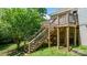 Wooden deck with stairs provides outdoor living space and backyard access to the home at 109 Gatwick Ct, Statesville, NC 28677