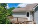 Outdoor deck area featuring wooden construction and a door to the house at 109 Gatwick Ct, Statesville, NC 28677