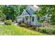Scenic view of a well-maintained home with lush landscaping, offering a serene and private outdoor space at 109 Gatwick Ct, Statesville, NC 28677