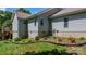 Exterior view of the house with light blue siding, concrete foundation and flower bed near the lawn at 109 Gatwick Ct, Statesville, NC 28677